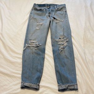 Perfectly distressed, well worn light wash, Levi’s, straight leg, button fly 29